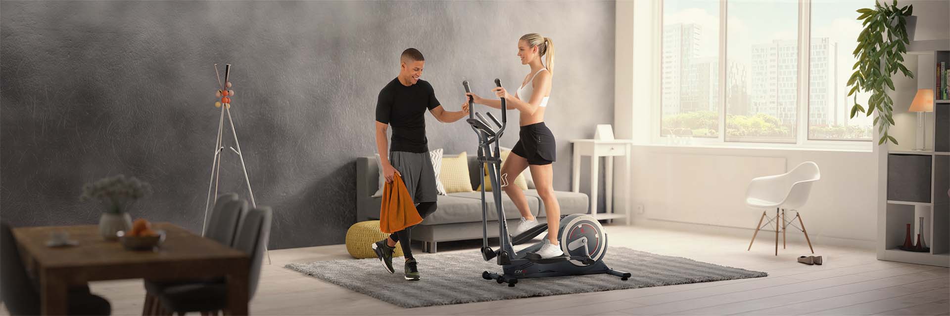 Schwarzes Laufband F10 Sportstech Frau in Sportbekleidung läuft auf schwarzem Laufband F10 im Wohnzimmer